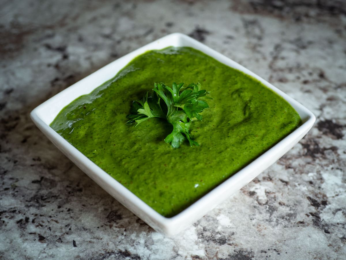 Chimichurri garnished with fresh parsley.