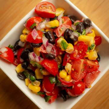 Black bean and corn salsa in a white serving dish.