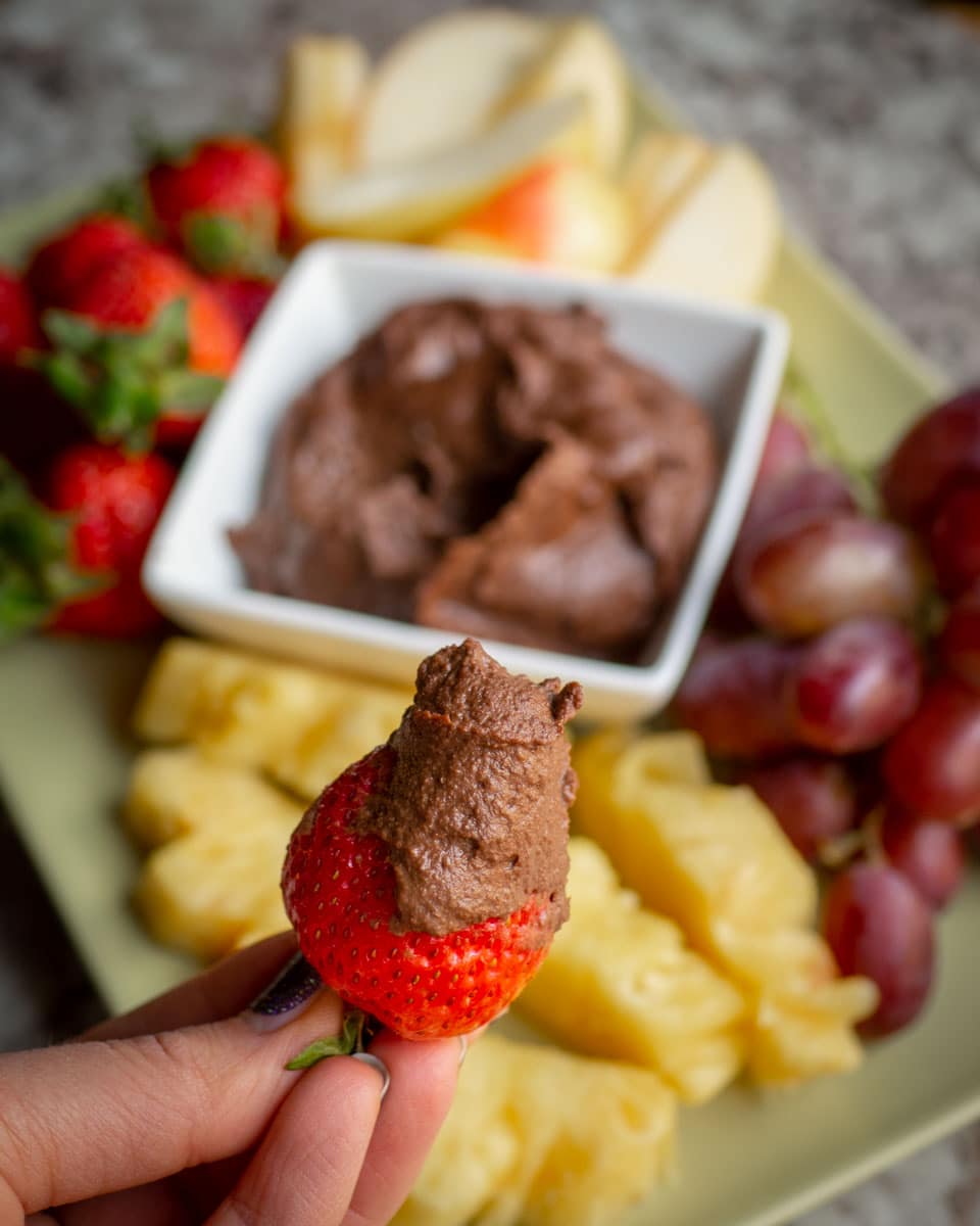 Strawberry dipped in chocolate hummus.