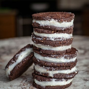 Stack of homemade Oreo-inspired cookies on a counter top.