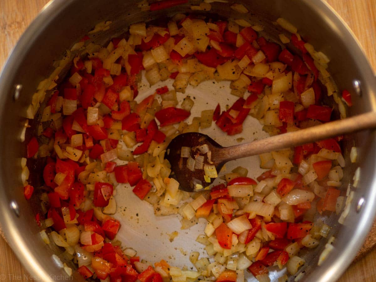 Onions and peppers in a pot.