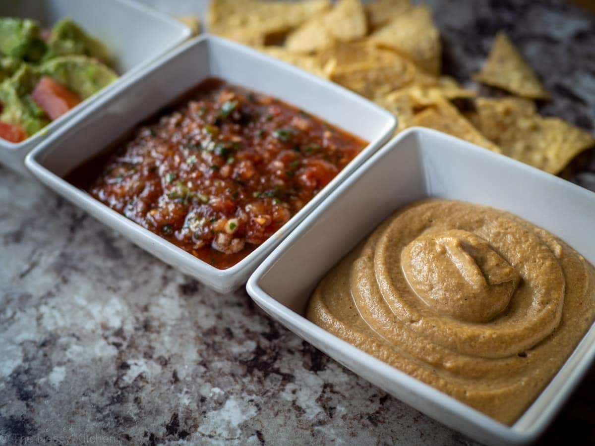 Bowls of queso, salsa and guacamole.