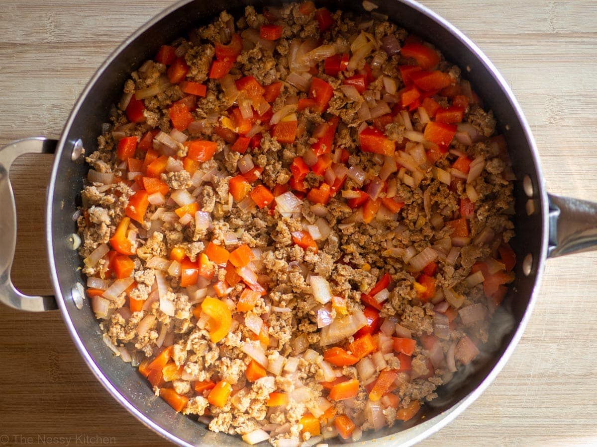 Onions, red pepper and Chorizo sausage in a skillet.