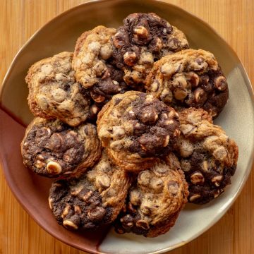 Plate full of half and half cookies.