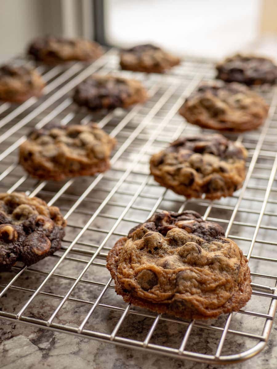 Half and half cookies on a cooling rack.