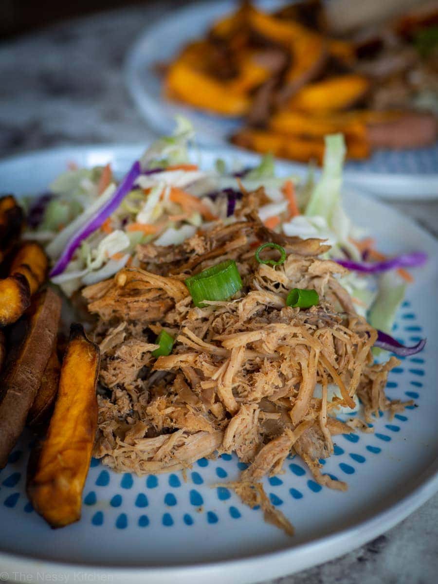 Pulled pork on a bed of coleslaw.