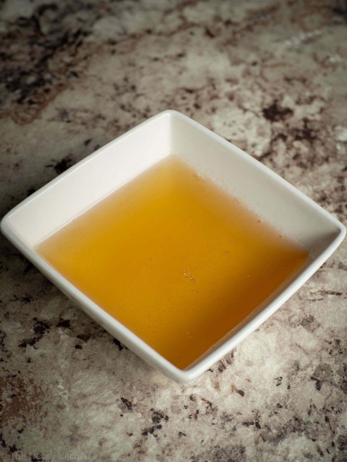 Honey simple syrup in a bowl.