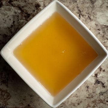 Bowl of honey dissolved in water.