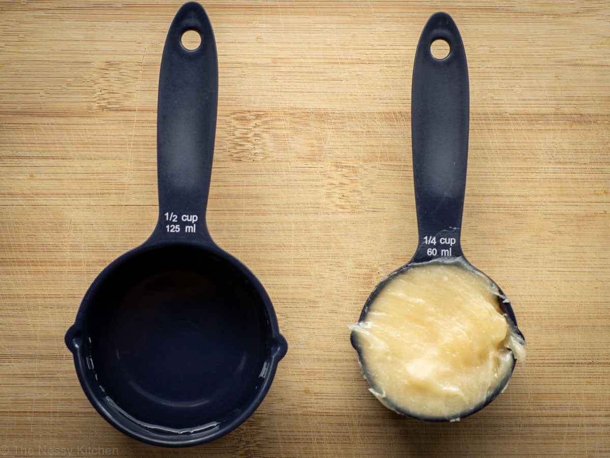 Honey and water in measuring cups.