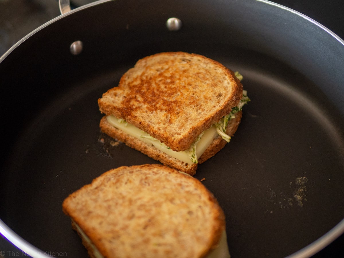 Chimichurri chicken sandwich being grilled in a frying pan.