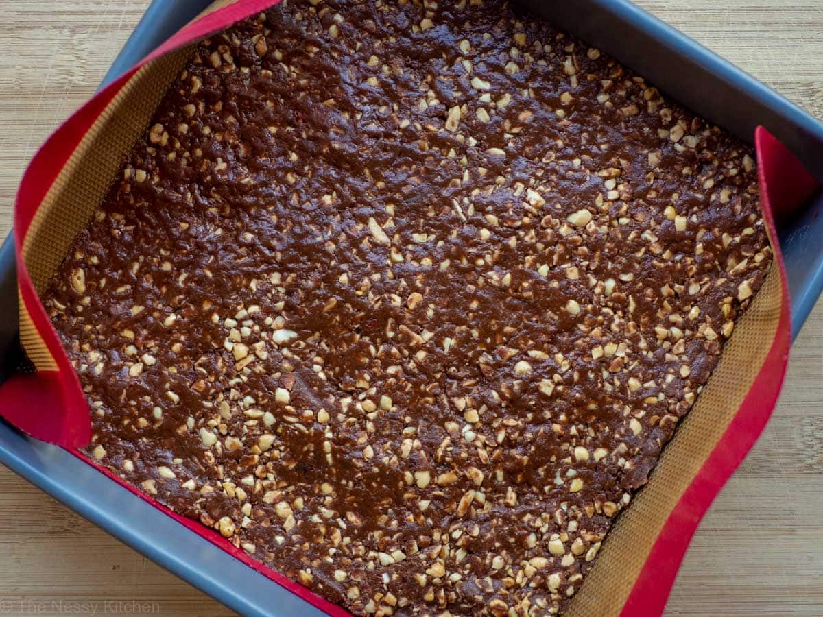 Eatmore batter pressed into a 9x9 inch baking pan.