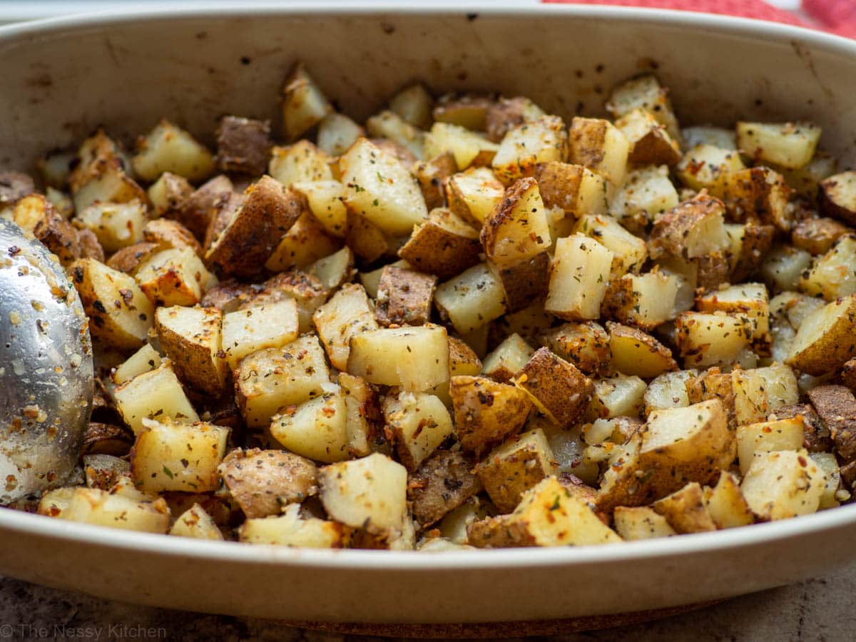 Onion roasted potatoes in baking dish.