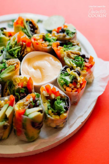 Rice paper rolls filled with corn, black beans and peppers.