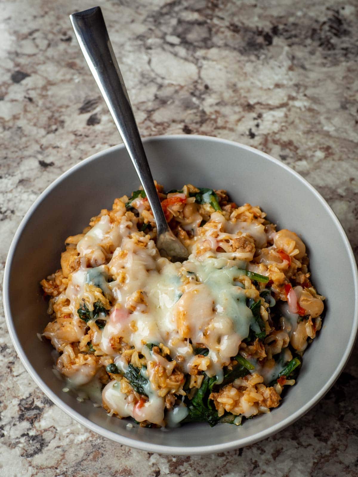 Italian sausage and rice skillet topped with optional cheese.