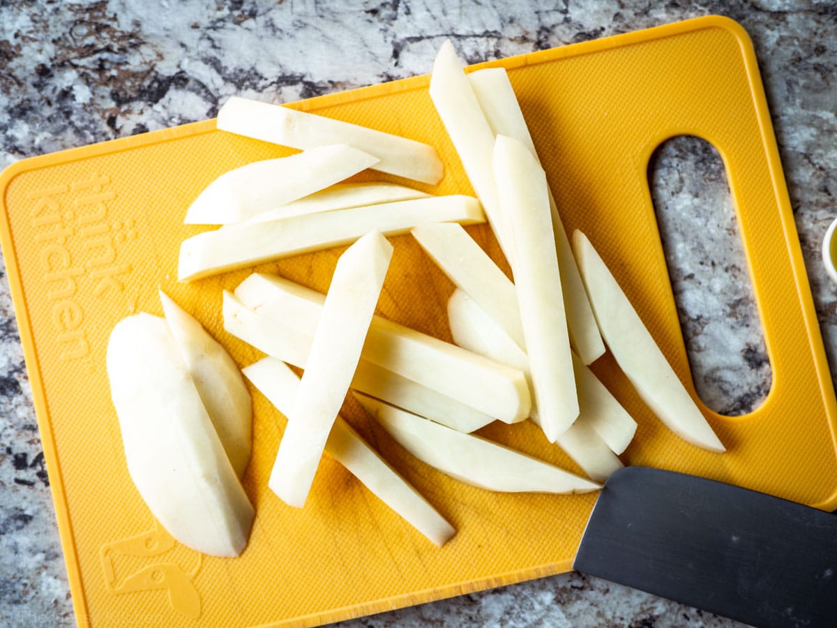 Potatoes sliced into the shape of fries.