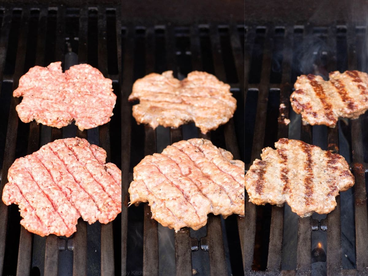 Beef burgers on a barbecue.