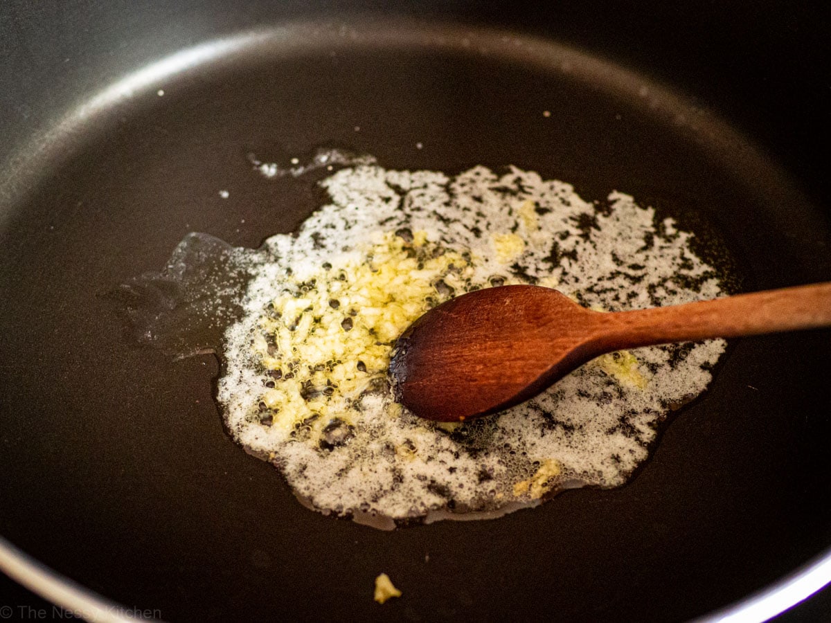 Garlic sautéed in butter in a skillet.