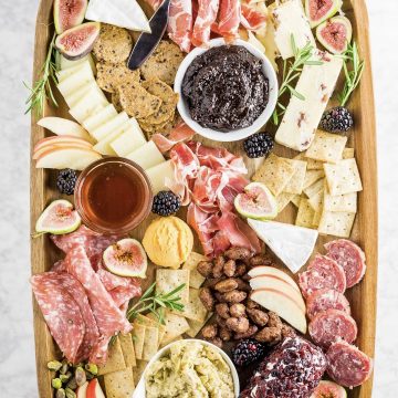 Charcuterie board with an assortment of meats and cheeses.