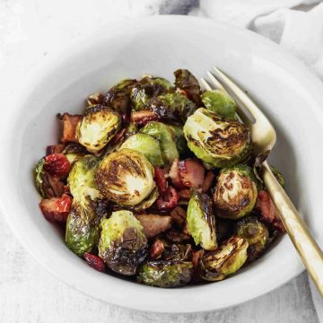 Brussels sprouts in a bowl with bacon.