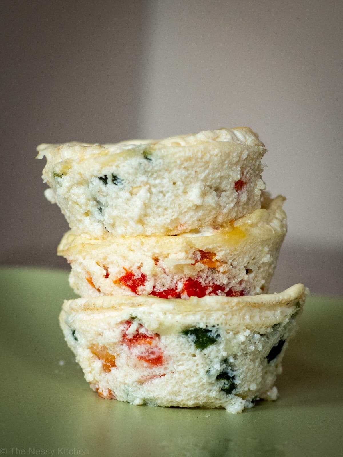 Stack of egg white bites on a plate.