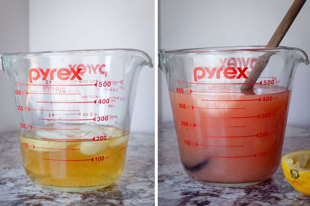 Measuring cup with tea and juice being mixed together.