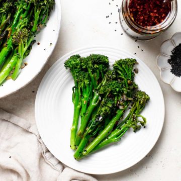 Roasted broccolini on a plate.