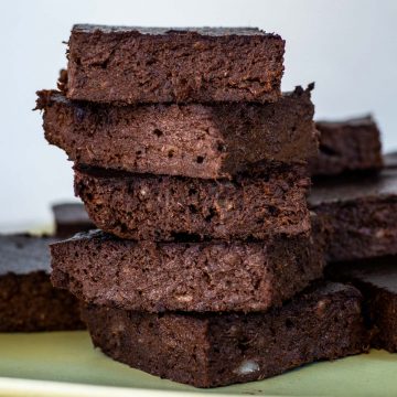 Stack of brownies on a plate.