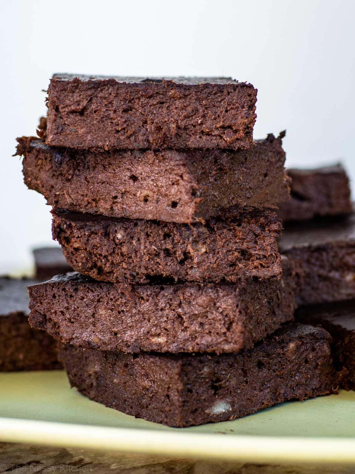 3 ingredient banana brownies stacked into a tower.