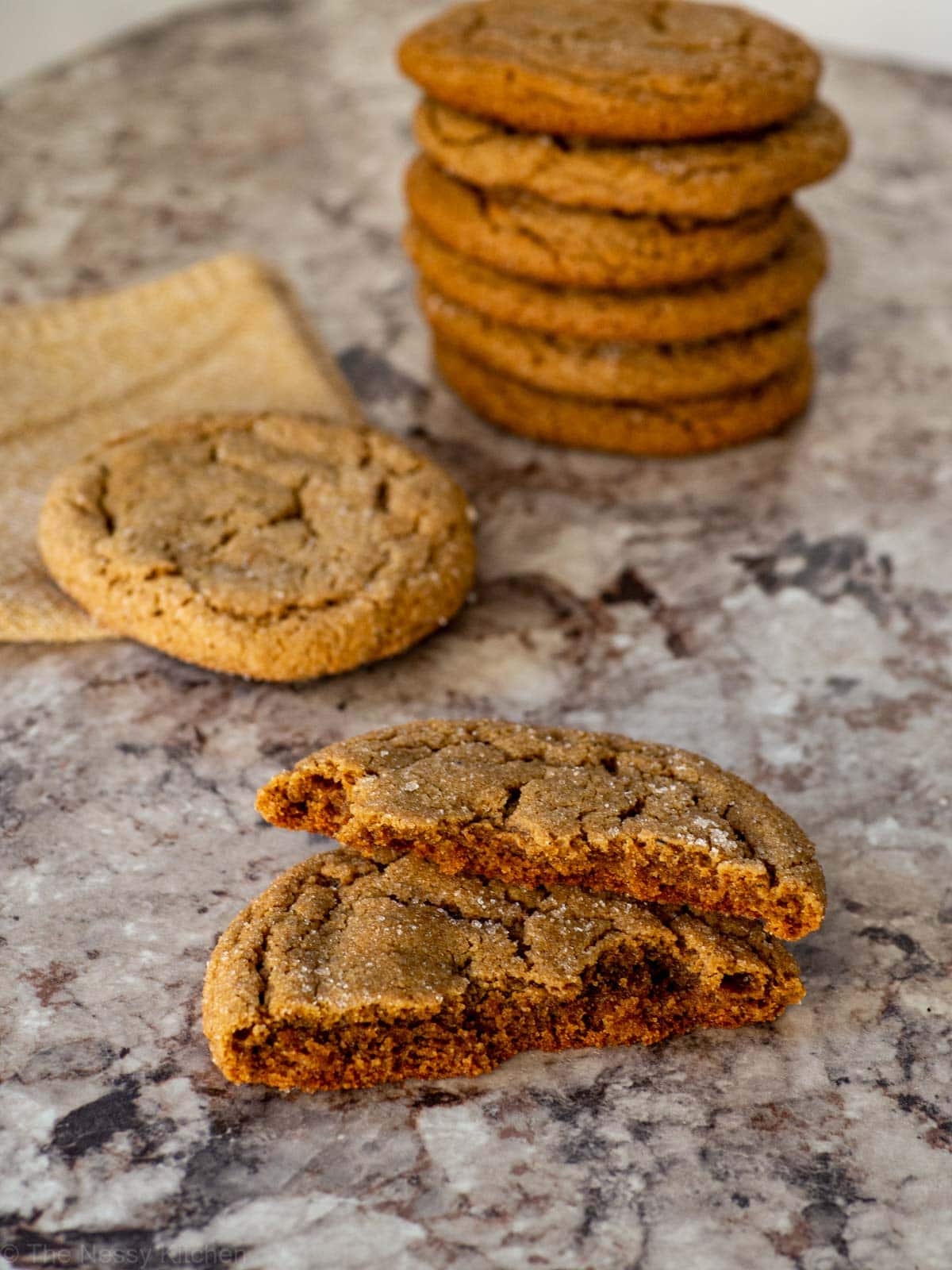 Oat flour gingersnap broken in half.