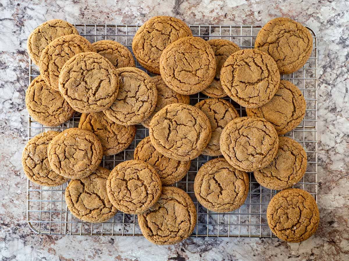 Oat flour gingersnaps cooling on a wire rack.