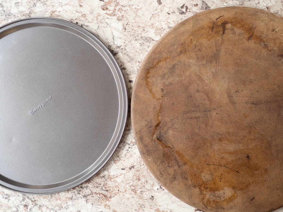 Side by side picture of a pizza stone and baking pan.