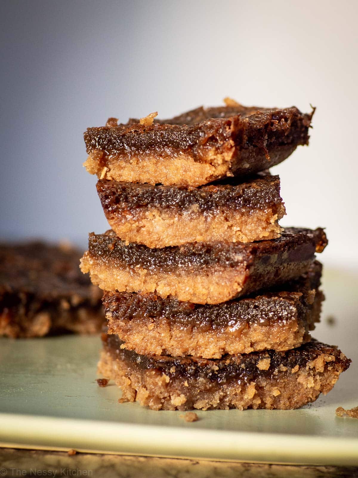 Stack of butter tart squares.