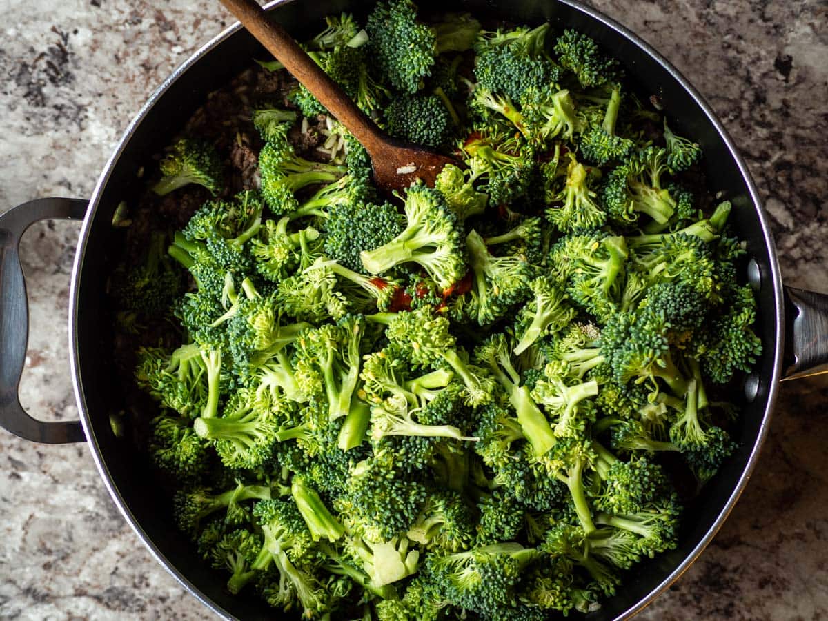 Broccoli added to the skillet with the rice and ground beef.
