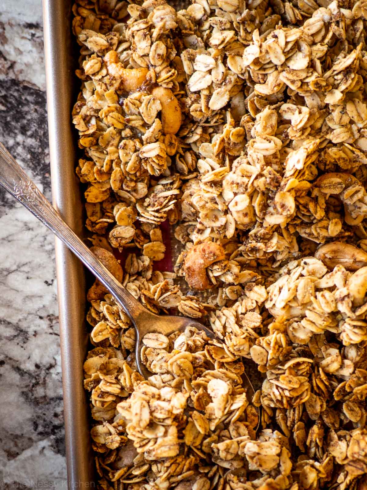 Sheet pan with a spoon scooping a bite off.