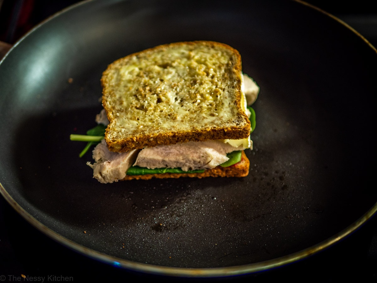 Cranberry turkey sandwich in a large skillet.