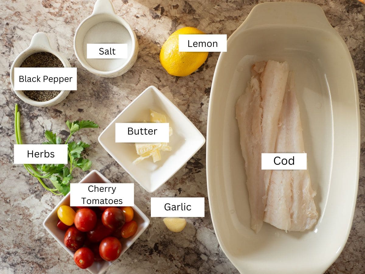 Ingredients for one pan roasted cod with cherry tomatoes.