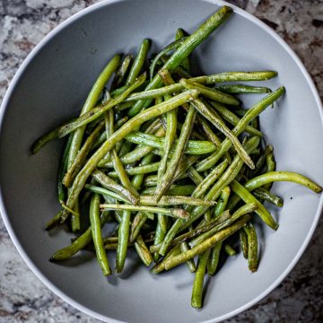 Gray bowl filled with green beans.