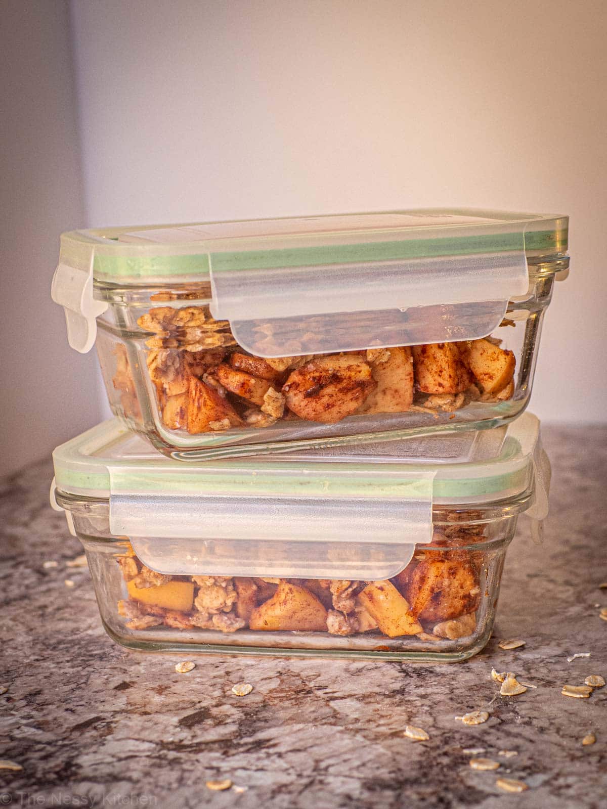 Apple crisp stored in two airtight glass containers.