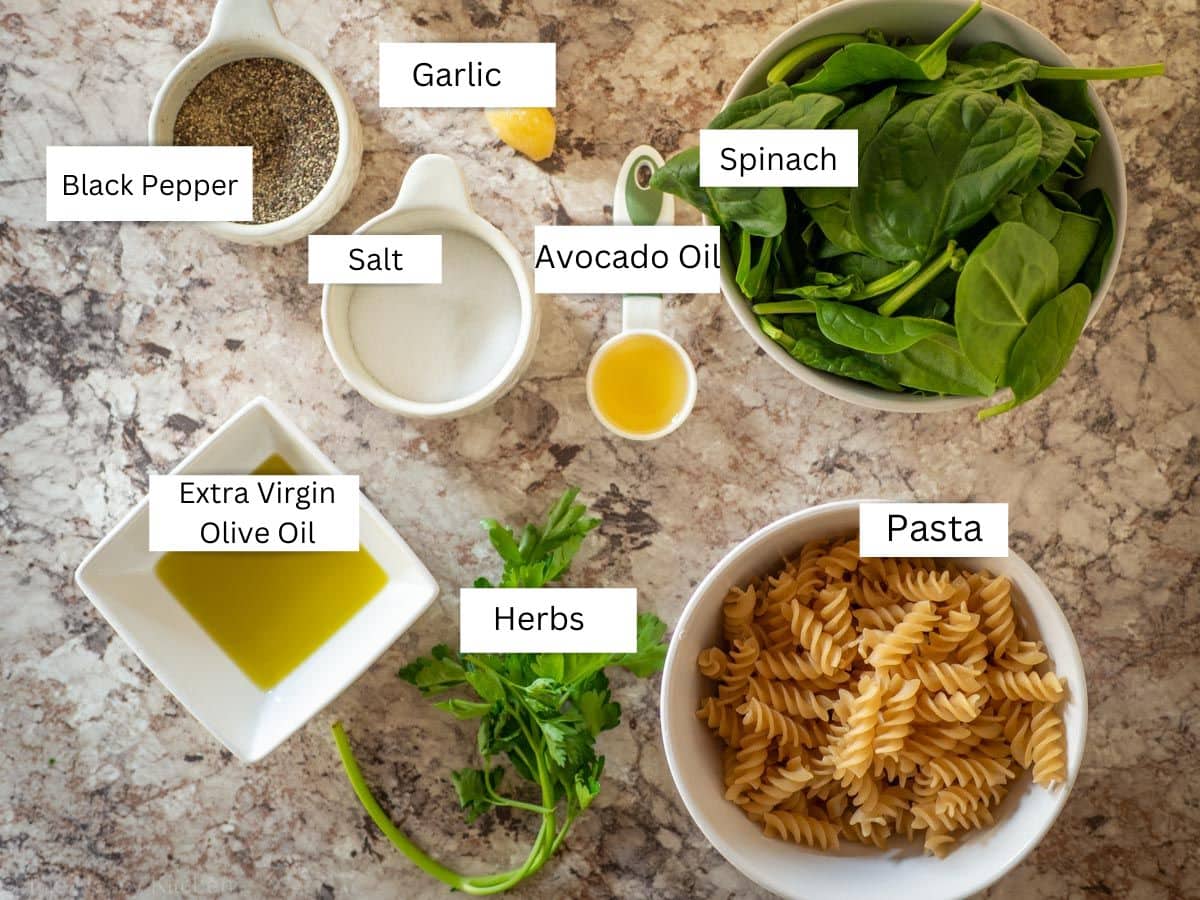 Ingredients for pasta with sautéed spinach.