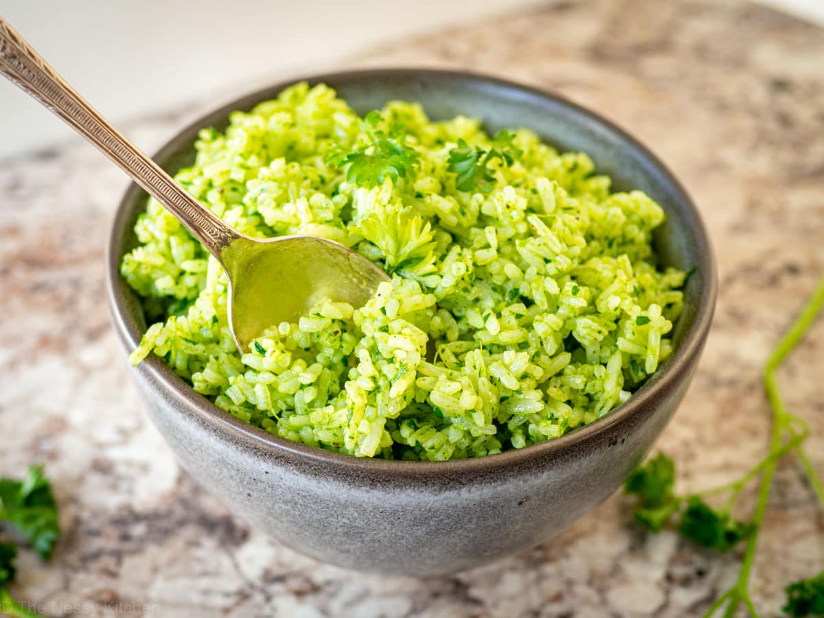 Bowl of Chimichurri rice with a spoon sitting in the bowl.