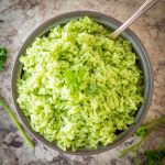 Bowl of green chimichurri rice.