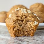Oat flour apple muffin with a bite taken out.