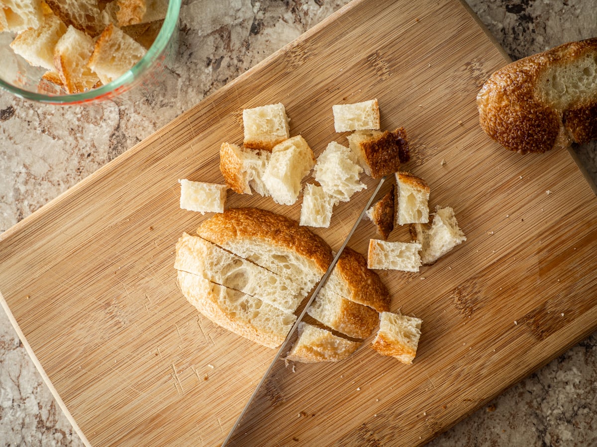 Bread sliced on a cutting board.