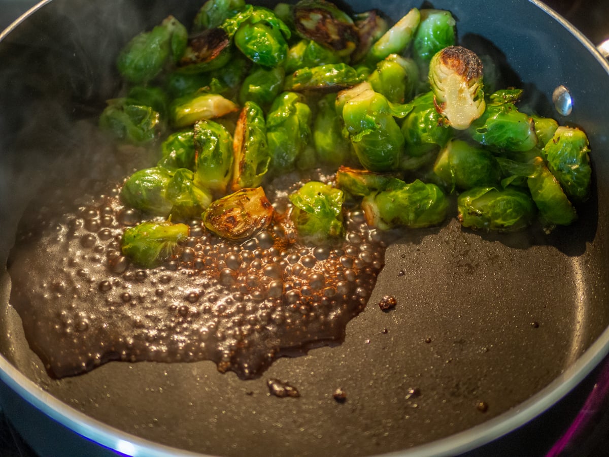 Balsamic vinegar poured into the frying pan.