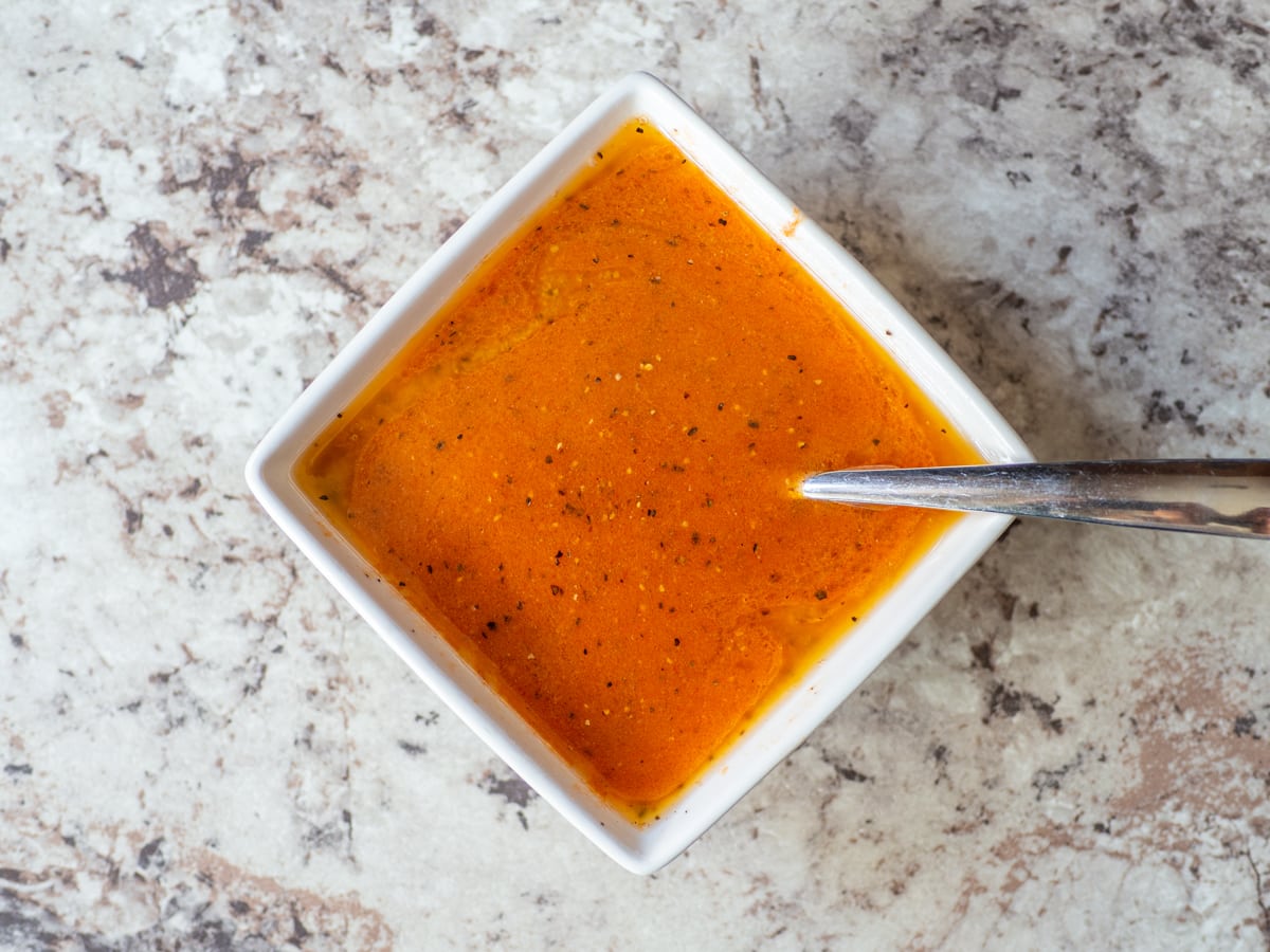 Buffalo sauce mixed together in a small bowl.