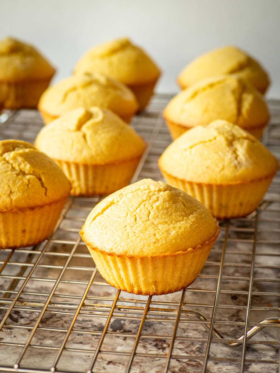 Cornbread muffins on a cooling rack.