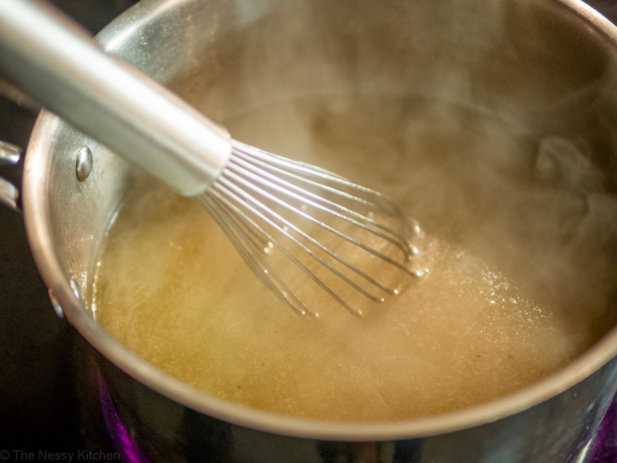 Cornstarch whisked into drippings and broth.