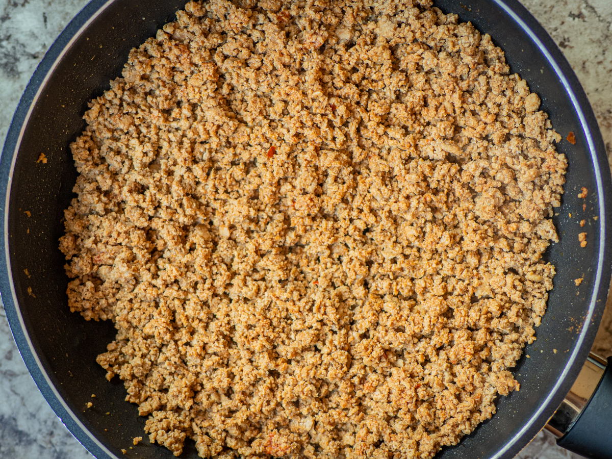 Ground turkey browned in a pan with taco seasoning.