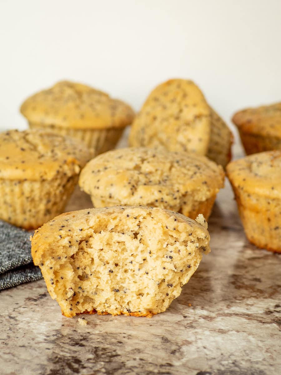 Lemon poppyseed muffin with a bite taken out.