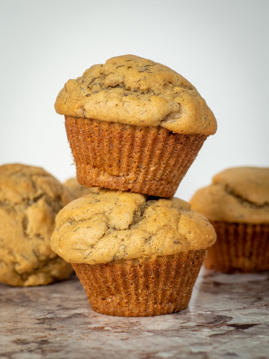 Banana muffins stacked on top of one another.